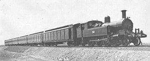 D
E
D
{\displaystyle \mathrm {D_{E}^{D}} }
750 with the first set of Tait suburban passenger carriages, 1910. From 1918 onwards these carriages were converted into Electric Multiple Unit trains, superseding the
D
E
D
{\displaystyle \mathrm {D_{E}^{D}} }
locomotives. DDE750.jpg