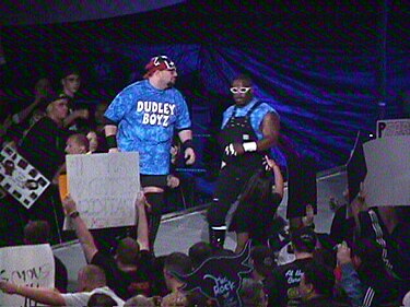 Buh Buh Ray Dudley and D-Von Dudley in 1999, wearing the Dudley Brothers' signature tie-dye shirts, overalls and glasses Dudley Boys 1999 WWF Smackdown (WWE).jpg