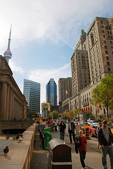 Downtown Toronto from Front Street, with the CN Tower (left background), Union Station (left foreground), Simcoe Place (centre), and Fairmont Royal York (right) in view in 2007. Architecture in Toronto can be described as an eclectic combination of various architectural styles. Front Street in Toronto.JPG