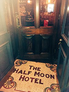 Photo of the tiled entrance to the Half Moon Hotel in Herne Hill, London. Half Moon Herne Hill doorway mosaic 2018.jpg