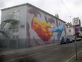 Berührende Hände, Grafitti von Jan-David Duck, 30 x 10 Meter, Hauptgebäude des Umspannwerks der Netze BW, Stuttgart, Sattlerstraße 12.