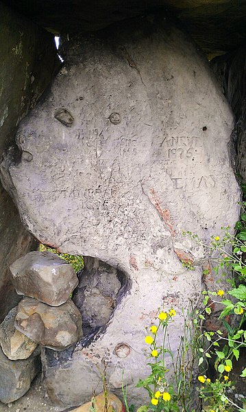 The back slab of the megalith, engraved with much graffiti.