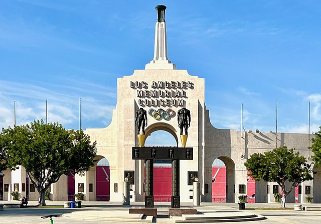 The Peristyle plaza entrance to the Coliseum, including the two bronze Olympic statues