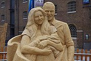 A sand sculpture of The Duke & Duchess of Cambridge and Prince George, sited on West India Quay (23 August 2013)