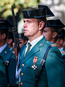 A Spanish Guardia Civil coalition member clears the - PICRYL - Public  Domain Media Search Engine Public Domain Search