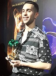 Mahmood with the Golden Lion award received for placing first in the Sanremo Music Festival.