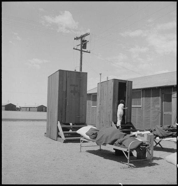 File:Manzanar Relocation Center, Manzanar, California. Hospital latrines, for patients, between the barr . . . - NARA - 538149.tif