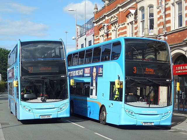 First generation (left) and second generation (right) Enviro400s of National Express Coventry, photographed in May 2022