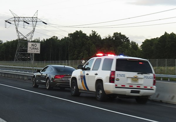 A New Jersey State Police trooper pulls over a vehicle on the New Jersey Turnpike