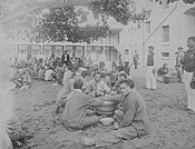 Prison inmates on Oahu eating poi circa 1890
