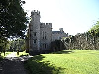Old Shute House, viewed from north, showing the addition (to the left with turret, north end facing viewer) built by Sir William Pole the Antiquary (1561-1635) in circa 1587-1600. The range behind to the right running perpendicular, i.e. to the west, is the original great hall of 1380. The now demolished porch stood adjacent on the east (left) of the turret, on the present driveway which leads onwards 1/2 mile to the south to New Shute House OldShuteHouseFromWest.jpg