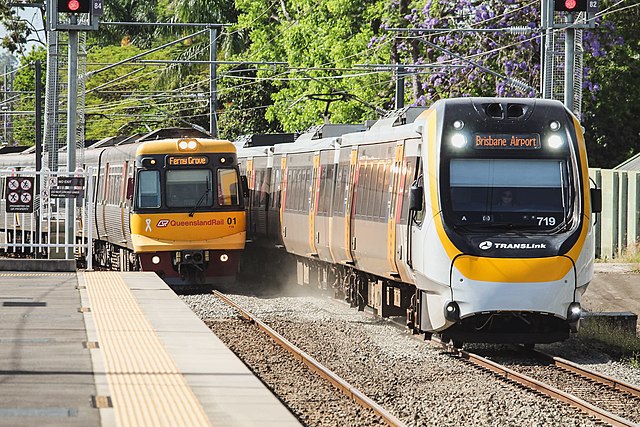 An Electric Multiple Unit (left) and a New Generation Rollingstock (right) – Queensland Rail's oldest and newest operational trains – at Altandi, Dece