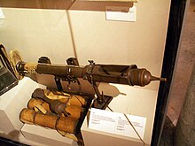 PIAT and ammunition case at the Canadian War Museum PIAT AT-SPG CDN WWII.jpg