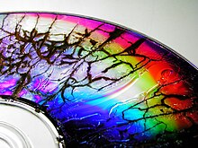 A microwaved DVD-R disc showing the effects of electrical discharge through its metal film RainbowDVD.jpg