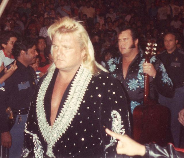 Valentine (left) with his Rhythm and Blues tag team partner The Honky Tonk Man (March 7, 1989)