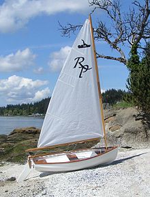 A Minto-class sailing dinghy, showing the steamboat emblem on the sail Rich Passage Minto Sailing Dinghy.jpg