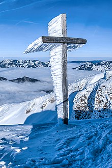 Wind blown rime ice formed on the summit cross of the Fronalpstock Rime-ice-found-on-summit-cross.jpg