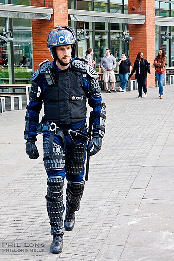 Riot police with body protection against physical impact. It does not provide very much protection against firearms, however.