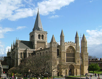 Rochester Cathedral, 1115–1280, west front 1150 (west window 1470). The west front has its interior forms emphasised by the verticals of the large pinnacled buttresses. The portal is richly carved with Christ in Majesty.
