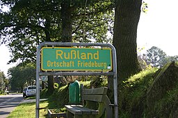 Signpost "Rußland" ( = Russia) in the community of Friedeburg, district of Wittmund, East Frisia, Germany