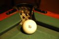Russian pyramid ball at a corner pocket. The relative size of the ball and the pocket makes the game very challenging.