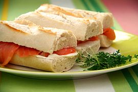 Smoked salmon-and-cream-cheese sandwiches on pieces of baguette