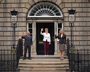 First Minister Nicola Sturgeon and the co-leaders of the Scottish Greens, Patrick Harvie and Lorna Slater, outside Bute House on 30 August 2021 Scottish Greens to enter government (51413925860).jpg
