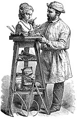 Thumbnail for File:Sculptor using F.W. Devoe &amp; C.T. Raynolds Company modeling stand.jpg