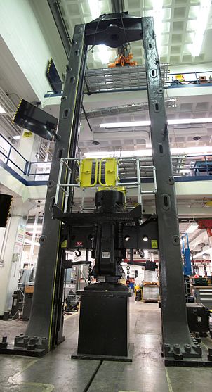 The Southwark Emery universal testing machine has a capacity of 600,000 lb (3 MN) and can test specimens up to 18 ft (5.5 m) tall. Southwark-Emery Universal Testing Machine.jpg