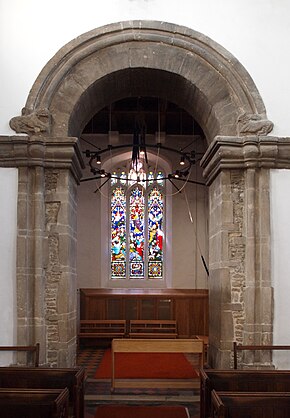 The 11th-century tower arch with animal carvings St Benet's Arch B.jpg