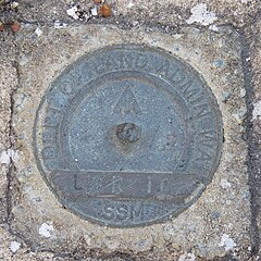 A Department of Land Administration land survey marker at Grigsons Lookout, Jurien Bay, a survey location dating back to 1875 Survey marker at Grigsons Lookout, Jurien Bay, Western Australia, September 2023.jpg