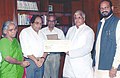 The Union Minister for Railways, Shri Lalu Prasad being presented a final dividend cheque of Rs. 7.3 crores by the Managing Director of RITES Ltd. Shri V.K. Agarwal in New Delhi on August 19, 2004.jpg