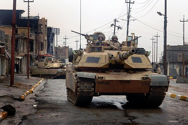 U.S. Army M1A2 Abrams tanks patrol the streets of Tal Afar, Iraq in February 2005.