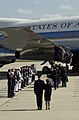 The casket is carried to the waiting Presidential Jet as it prepares to return to California