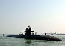 Sailors assigned to USS Philadelphia stand topside as the submarine gets underway US Navy 071007-N-0916O-231 Sailors assigned to Los Angeles-class attack submarine USS Philadelphia (SSN 690) stand topside as the submarine gets underway.jpg