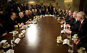 Admiral Mike Mullen and Secretary of Defense Robert M. Gates attend a meeting of combatant commanders with President George W. Bush in the Cabinet Room at the White House, 2008.