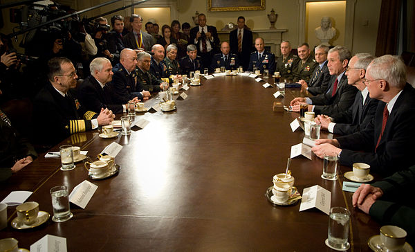 President George W. Bush (sitting third from the right) and Secretary of Defense Robert Gates (sitting second from the left) meeting with the joint ch