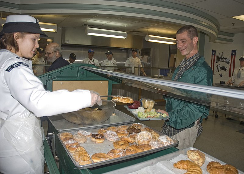 File:US Navy 090701-N-1060K-030 Seaman Sarah Ricket, assigned to USS Constitution, serves dessert to a resident of the New England Shelter for Homeless Veterans.jpg