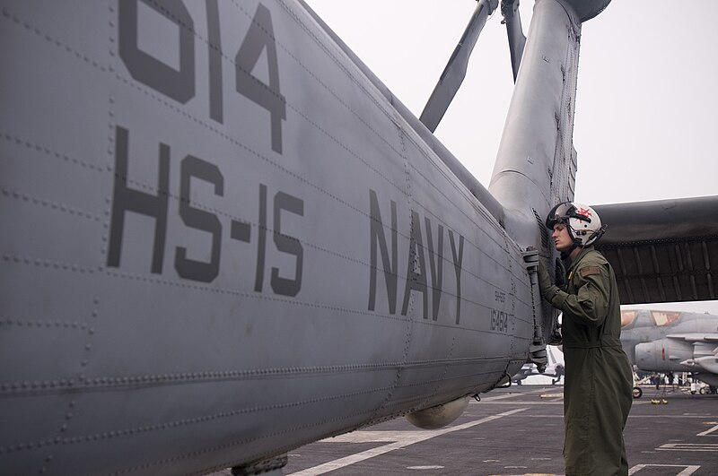 File:US Navy 111230-N-TZ605-399 Naval Air Crewman 2nd Class Sean Murphy, assigned to Helicopter Anti-Submarine Squadron (HS) 15, inspects an SH-60F Sea.jpg