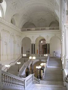 View of one of the main stairs (Hauptstiege) in the University of Vienna Uni Wien Feststiege, Vienna 2.jpg