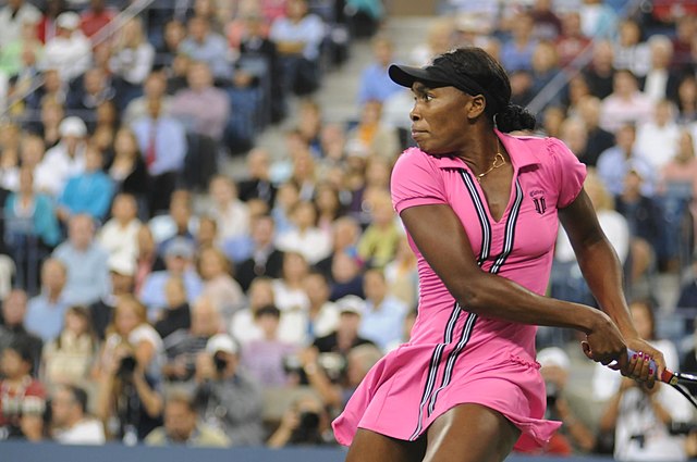 Venus Williams returns against Vera Dushevina on the opening day