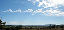 An unusual cloud formation over Mount Duval and Little Duval (on left), due to Kelvin-Helmholtz instability