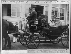 William H. Taft, half length, seated in carriage with Miss Roosevelt and Mr. Nagasaki leaving the Resting Palace in Yokohama, facing left LCCN2006682638.jpg