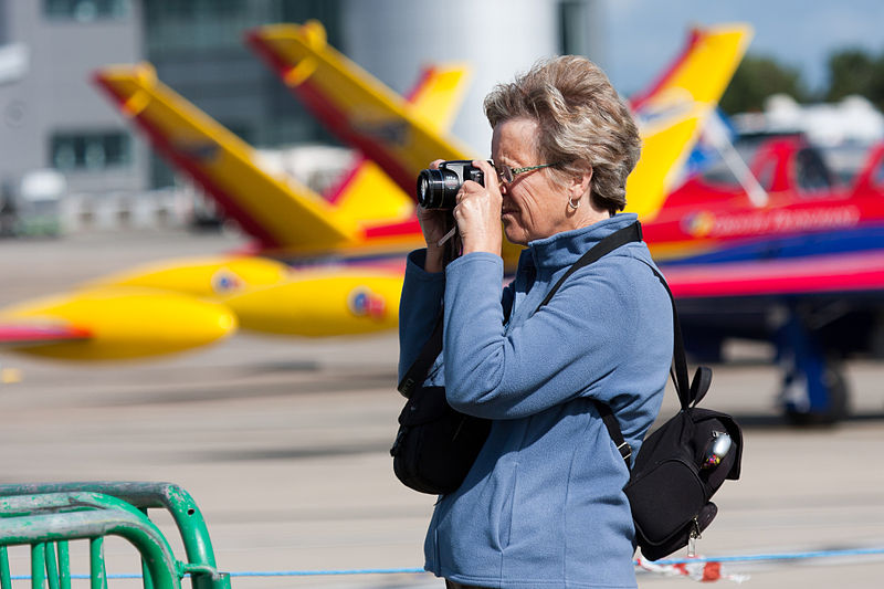 File:Woman with camera at jersey airport.JPG