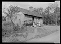 "Home of a renter on a small farm in Sevier County, Tennessee. Note the attempt to beautify the place with potted... - NARA - 532631.tif