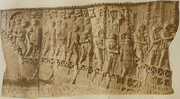 Roman legionaries marching across a pontoon bridge, a relief scene from the column of Emperor Trajan (r. 98–117 AD) in Rome, Italy (monochrome, from t