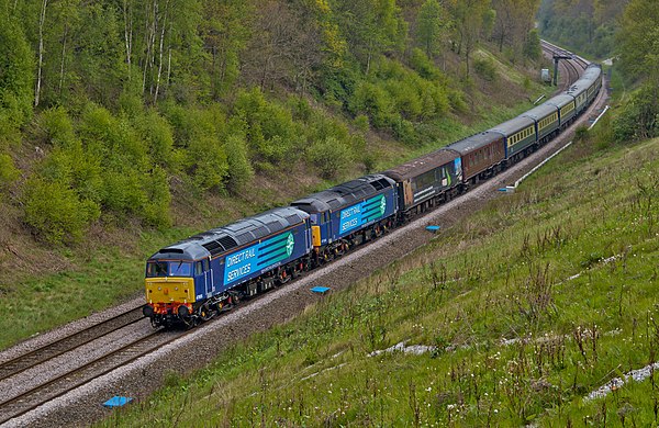 A pair of DRS Class 47s hauling a rake of carriages passing near Stretton, Derbyshire
