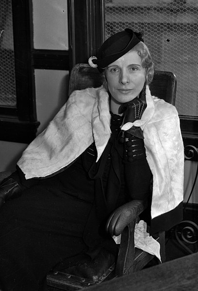File:Aimee Semple McPherson seated in a law office.jpg