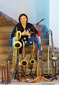 Amir Gwirtzman in Tel Aviv with the musical instruments he plays. Photo: Kristina Gwirtzman. Amir Gwirtzman with musical instruments.jpg