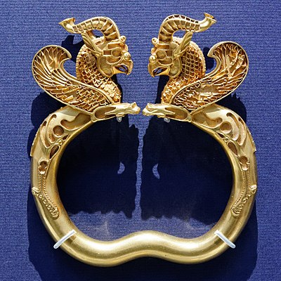 One of a pair of armlets from the Oxus Treasure, which has lost its inlays of precious stones or enamel